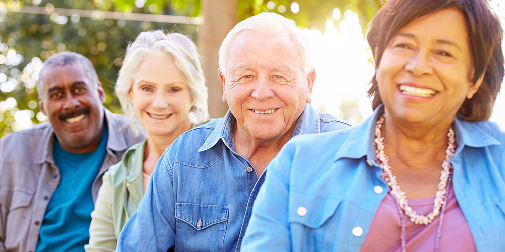 Two men and two women smiling