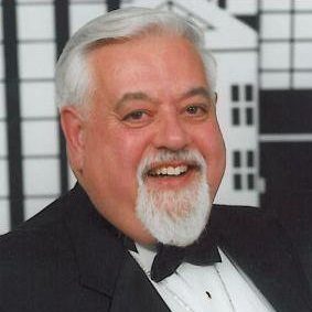 Man in tuxedo smiling