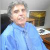 Man sitting and smiling at camera