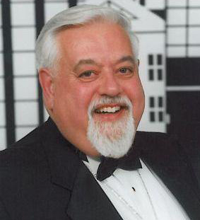 Man in tuxedo smiling